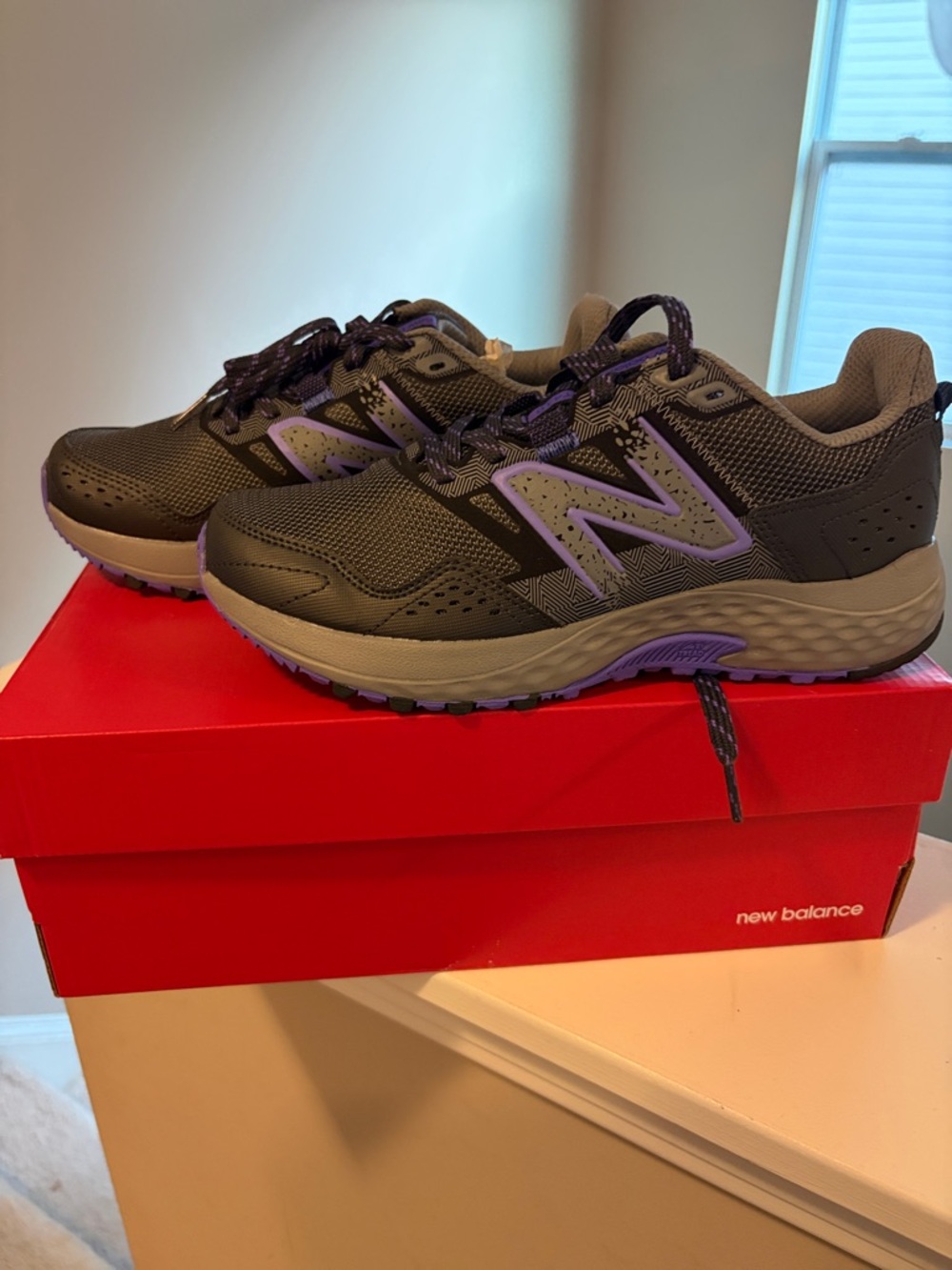 New Balance Woman’s Gray and Purple Trail Sneakers